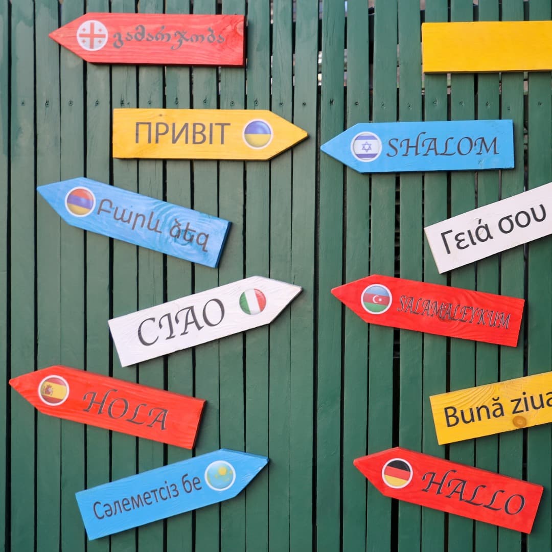 Lots of signs in different languages, all saying hello